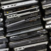 A pile of laptop computers ready to be reused or recycled by Stena Recycling.